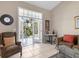 Bright living room featuring tile floors and lanai access at 3803 54Th W Dr # 203, Bradenton, FL 34210