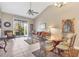 Open floor plan with living room, dining area, and balcony access at 3803 54Th W Dr # 203, Bradenton, FL 34210
