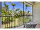 Enclosed patio featuring a wicker chair, offering views of the serene and green outdoor area at 3803 54Th W Dr # 203, Bradenton, FL 34210