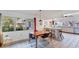 Bright dining area with a wooden table, leading into an open kitchen space at 4062 S Shade Ave, Sarasota, FL 34231