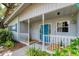 Close-up of a charming covered front porch, showcasing the home's welcoming entrance at 4062 S Shade Ave, Sarasota, FL 34231