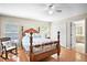 Well-lit bedroom featuring wood floors, a four-poster bed and bright windows at 4110 Noble Pl, Parrish, FL 34219