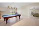 Spacious game room featuring a blue billiards table and open floorplan at 4110 Noble Pl, Parrish, FL 34219
