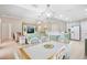Open-concept living room with tile floors, eat-in kitchen and modern décor at 4110 Noble Pl, Parrish, FL 34219