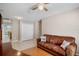 Living room featuring a comfortable sofa, tile floors, and ample closet space at 4110 Noble Pl, Parrish, FL 34219