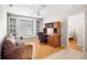 Office featuring built-in bookshelves, desk, and comfortable couch at 4110 Noble Pl, Parrish, FL 34219