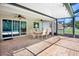 Large patio area offers access to a pool and peaceful views at 4110 Noble Pl, Parrish, FL 34219