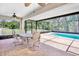 Enjoy outdoor living on this spacious patio with view of the screened-in pool at 4110 Noble Pl, Parrish, FL 34219