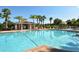 Community pool featuring chairs and a large lounging area to enjoy the weather at 4110 Noble Pl, Parrish, FL 34219