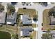 Aerial view of a home showing the roof, driveway, and surrounding neighborhood at 4202 Donnington Dr, Parrish, FL 34219