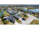 Aerial view of a home in a neighborhood with mature trees and landscaping at 4202 Donnington Dr, Parrish, FL 34219