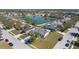 Aerial view of home in a suburban neighborhood with a community pond at 4202 Donnington Dr, Parrish, FL 34219