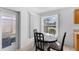 Bright dining area featuring a modern table set and a glass sliding door to the outdoor patio at 4202 Donnington Dr, Parrish, FL 34219