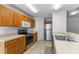 Well-equipped kitchen with wood cabinets, stainless steel appliances, and ample counter space at 4202 Donnington Dr, Parrish, FL 34219