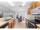 Bright kitchen boasts ample counter space, modern appliances, and an adjacent dining area for easy entertaining at 4202 Donnington Dr, Parrish, FL 34219