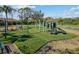 Playground offers picnic bench, swings, turf, and play structure. Fully fenced and secured for community enjoyment at 4202 Donnington Dr, Parrish, FL 34219