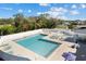 Community pool boasts a spacious deck area with plenty of lounge chairs and a separate area at 4202 Donnington Dr, Parrish, FL 34219