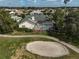 Aerial view of a home with a screened-in pool, a backyard, and golf course views at 4306 Presidential Avenue E Cir, Bradenton, FL 34203
