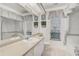 Bright bathroom featuring a bathtub, vanity with mirror, and window with natural light at 4306 Presidential Avenue E Cir, Bradenton, FL 34203