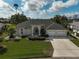 Aerial of a single-story home, landscaped yard, and a two car garage and decorative front entrance at 4306 Presidential Avenue E Cir, Bradenton, FL 34203