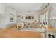 Bright living room featuring hardwood floors, a decorative window, and a sliding glass door leading outside at 4306 Presidential Avenue E Cir, Bradenton, FL 34203