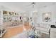 Spacious and bright open-concept living and dining area, featuring hardwood floors and neutral decor at 4306 Presidential Avenue E Cir, Bradenton, FL 34203