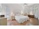 Airy main bedroom with high ceilings, large windows, and pristine decor throughout the space at 4306 Presidential Avenue E Cir, Bradenton, FL 34203