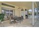 Covered patio with a dining table, ceiling fan, and views of the backyard at 4306 Presidential Avenue E Cir, Bradenton, FL 34203