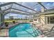 Sparkling pool with a screened enclosure and an attached spa for ultimate relaxation at 4306 Presidential Avenue E Cir, Bradenton, FL 34203
