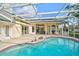Large pool with a screened enclosure and a spacious patio area for outdoor living at 4306 Presidential Avenue E Cir, Bradenton, FL 34203