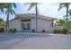 Community clubhouse with a clean facade, ample parking, and welcoming landscaping at 4726 Dundee Dr, Bradenton, FL 34210