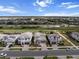 Aerial view of gray homes in a well-planned community with a green landscape at 4793 Antrim Dr, Sarasota, FL 34240
