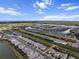Expansive aerial view of a Primary-planned community with beautiful homes and scenic water features under a bright, cloudy sky at 4793 Antrim Dr, Sarasota, FL 34240