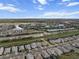 An aerial shot captures the community's expansive layout, featuring homes nestled around tranquil lakes and vibrant green spaces at 4793 Antrim Dr, Sarasota, FL 34240