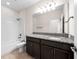 Bathroom featuring a shower/tub combo, vanity with granite countertops, and tiled floors at 4793 Antrim Dr, Sarasota, FL 34240
