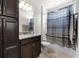 Bathroom with a shower/tub combo, vanity with granite countertops, and tiled floors at 4793 Antrim Dr, Sarasota, FL 34240