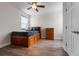 Bedroom showcasing luxury vinyl plank floors, a ceiling fan, a bed, and a dresser at 4793 Antrim Dr, Sarasota, FL 34240