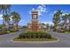 Community entrance to Worthington with palm trees and manicured shrubbery at 4793 Antrim Dr, Sarasota, FL 34240
