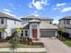 Beautiful two-story home featuring a well-manicured lawn and a two-car garage at 4793 Antrim Dr, Sarasota, FL 34240