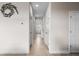 Hallway with neutral paint and decorative fish decor at 4793 Antrim Dr, Sarasota, FL 34240