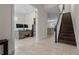 Hallway with office, staircase, and ceramic tile flooring at 4793 Antrim Dr, Sarasota, FL 34240