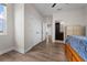 Hallway featuring luxury vinyl plank floors, three closets, and a view of the bathroom at 4793 Antrim Dr, Sarasota, FL 34240