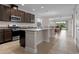 Modern kitchen with stainless steel appliances and a granite countertop island at 4793 Antrim Dr, Sarasota, FL 34240