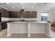Spacious kitchen featuring granite countertops, dark cabinets, and recessed lighting at 4793 Antrim Dr, Sarasota, FL 34240