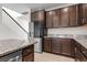 Open kitchen design features stainless steel refrigerator and granite countertops at 4793 Antrim Dr, Sarasota, FL 34240