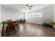 Living room features plenty of space, three windows, and luxury vinyl plank flooring at 4793 Antrim Dr, Sarasota, FL 34240