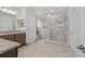 Elegant main bathroom with a large glass-enclosed shower, dual vanities, and modern fixtures at 4793 Antrim Dr, Sarasota, FL 34240