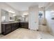 Large main bathroom featuring dual vanities, recessed lights, and a glass-enclosed shower with seating at 4793 Antrim Dr, Sarasota, FL 34240