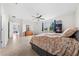 The main bedroom includes a ceiling fan, tiled floor, and sun-filled windows at 4793 Antrim Dr, Sarasota, FL 34240