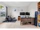 Well-lit home office space with ample sunlight, perfect for productivity and creativity at 4793 Antrim Dr, Sarasota, FL 34240